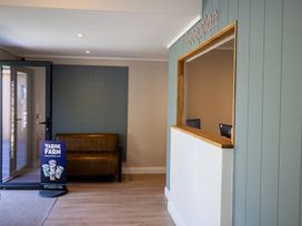 A reception area with a desk and sofa at Lodge 67 at Riviera Bay Coastal Retreat Brixham
