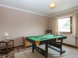 A games room with a pool table and a side table at Tir Mawr in Llanfairpwllgwyngyll