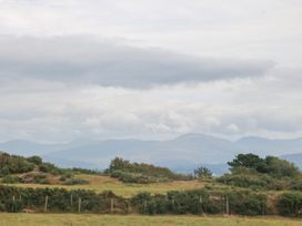 A landscape featuring mountains and clouds at Tir Mawr in Llanfairpwllgwyngyll