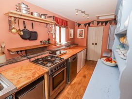A kitchen with various appliances and utensils at Pencestyll in Cardigan