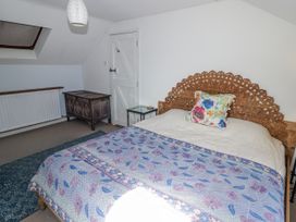 A bedroom with a bed and decorative chest at Pencestyll in Cardigan