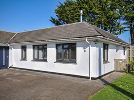 A bungalow with windows and a door at 6 Trelawney Court in Rock