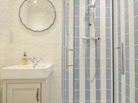 A bathroom with a sink and shower at 6 Trelawney Court Rock