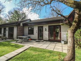 An outdoor area with a patio and picnic benches at Tolroy Manor Holiday Park St Erth Praze near Hayle