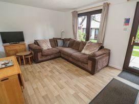 A living room with a sofa and television at Tolroy Manor Holiday Park St Erth Praze near Hayle