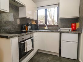 A kitchen with appliances and countertops at Tolroy Manor Holiday Park in St Erth Praze near Hayle