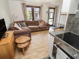 A living room with a sofa and coffee table at Tolroy Manor Holiday Park St Erth Praze near Hayle