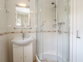 A bathroom with a shower and sink at Tolroy Manor Holiday Park St Erth Praze near Hayle