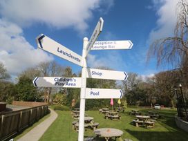 A signpost directing to various facilities at Tolroy Manor Holiday Park St Erth Praze near Hayle
