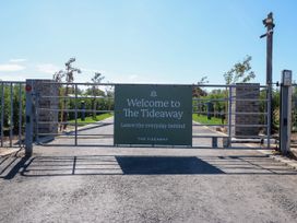 A gate with a welcome sign at The Tideaway in St. Osyth
