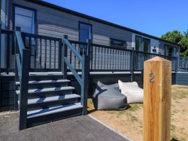 An outdoor area with stairs and bean bags at Lakewood Plot 2 St. Osyth