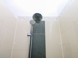 A shower with shower head and handheld fixture at Apple Mill Venn Ottery near Sidmouth