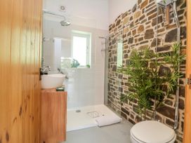 A bathroom with a shower, toilet, and wash basin at Burlodge Swimbridge near Barnstaple