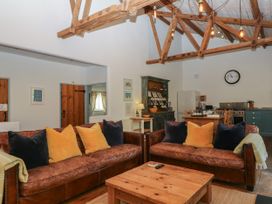 A living room with sofas and a coffee table at Burrows in Venn Ottery near Sidmouth