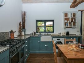 A kitchen with a sink and appliances at Burrows in Venn Ottery near Sidmouth