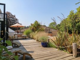 A garden with outdoor furniture and plants at Burrows Venn Ottery near Sidmouth