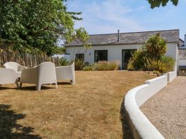 A garden with chairs and plants at Burrows in Venn Ottery near Sidmouth
