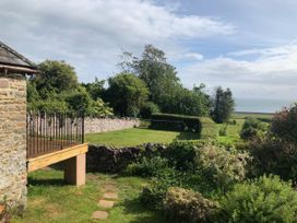 A garden with a sea view at Worthy Barn Porlock Weir