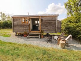 A trailer with steps and seating area at Cariad Mawr in Gwaenysgor near Prestatyn