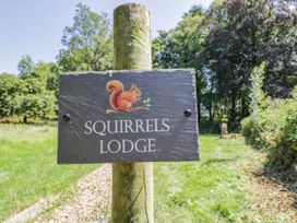A sign for Squirrels Lodge in South Molton