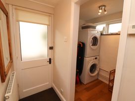 A laundry room with a washing machine and dryer at Byways in Ambleside