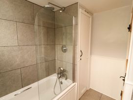 A bathroom with a bathtub and shower at Byways Ambleside