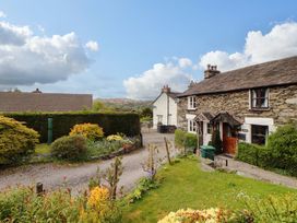 A view of houses with a garden and pathway at Byways Ambleside