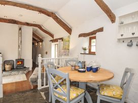 A dining room with a table and chairs at Skiber Long Bray Shop near Launceston
