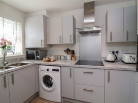 A kitchen with appliances and utensils at Seashell Sands in Appledore
