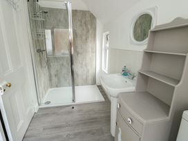 A bathroom with shower and sink at Noah's Rest in Llandudno