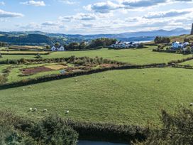 A landscape with sheep grazing in fields at The Manor House Skerry Vore in Bryn Pydew near Llandudno Junction