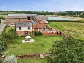 An outdoor view of a house and garden at Knights Farm in Harkstead