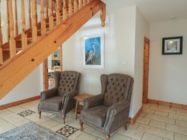 A hallway with two armchairs and a small table at The Skating Rock in Bunane near Kenmare, County Kerry
