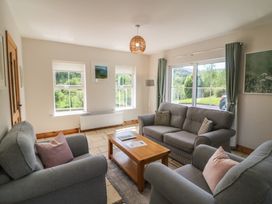 A living room with couches and coffee table at The Skating Rock in Bunane near Kenmare, County Kerry