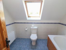 A bathroom with toilet and bath tub at The Skating Rock in Bunane near Kenmare, County Kerry