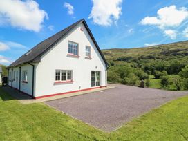 A house with windows and a driveway at The Skating Rock in Bunane near Kenmare, County Kerry