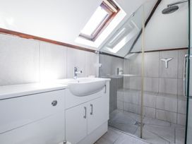 A bathroom with a shower and sink at Temple House in Goonhavern