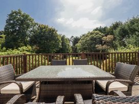 Outdoor seating area with a table and chairs at Temple House in Goonhavern