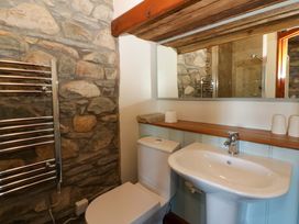 A bathroom with a sink and toilet at Parrog Stores near Newport, Pembrokeshire