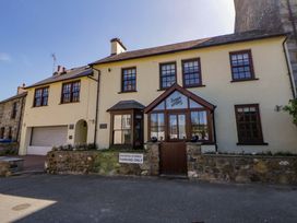 A building featuring a parking area at Parrog Bach in Parrog near Newport, Pembrokeshire
