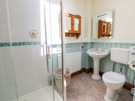 A bathroom with a shower, sink, and toilet at Parrog Bach, Parrog near Newport, Pembrokeshire