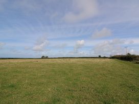 Open field with grass and clouds at Llainorfa in Maenygroes near New Quay