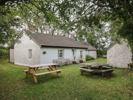 A house with a picnic table and chairs at Llainorfa Maenygroes near New Quay