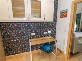 A workspace with a desk and chair at The Barn in Astwood Bank
