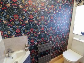 A bathroom with a sink and toilet at The Barn in Astwood Bank