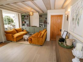 A living room with a sofa and coffee table at Bay House Cottage in Broadway