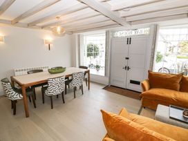 A dining room with a table and chairs at Bay House Cottage in Broadway