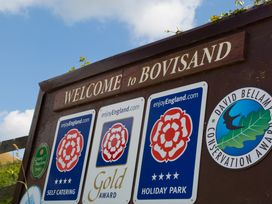 A welcome sign for Bovisand with tourism and conservation awards displayed at Caravan 7 in Plymouth