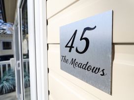 A sign with number 45 and text The Meadows mounted on an exterior wall at The Meadows 45 in Tattershall