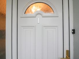 A door with number 1 and a window at No 1 Lodge Wood Kenmare, County Kerry